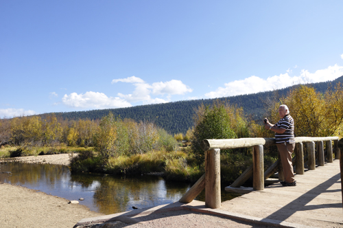 Lee Duquette on the bridge at Cub Lake trail in Rockuy Mountain National Park